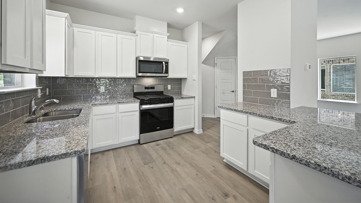 Aquamarine Floorplan Elevation A Kitchen Gallery Image - The Woods at Lindsey Place in Anna, TX