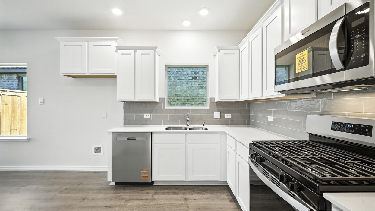 3215 Aquamarine Floorplan Kitchen Gallery Image-The Woods at Lindsey Place in Anna, TX