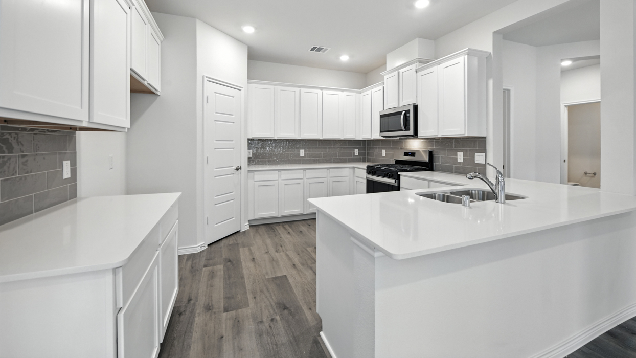 Tanzanite Floorplan Elevation B Kitchen Gallery Image - The Woods at Lindsey Place in Anna, TX