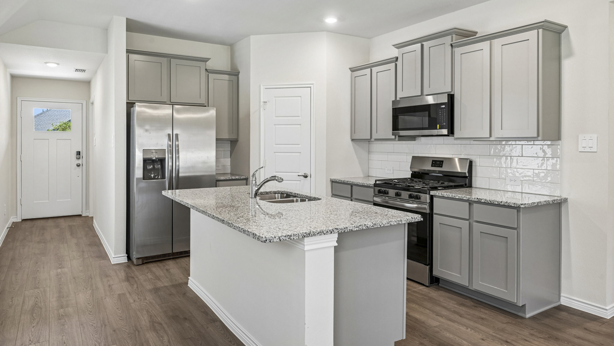 Allegra Floorplan Elevation B Kitchen Gallery Image - The Woods at Lindsey Place in Anna, TX