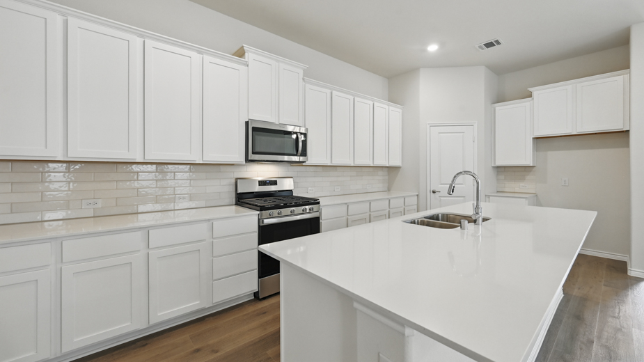 2054 Elevation F Kitchen Gallery Image -The Woods at Lindsey Place Anna TX