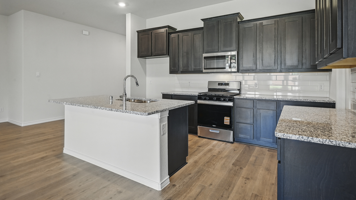 H50H Harbour Floorplan Elevation B Kitchen Gallery Image-The Woods at Lindsey Place in Anna, TX