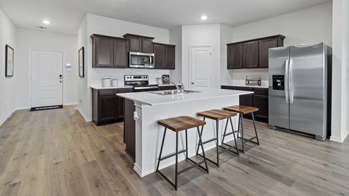X40O Ozark floorplan kitchen-living gallery image - Ranger Crossing in Princeton, TX