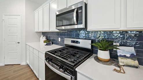 H235 Bastrop Floorplan Elevation F Kitchen Gallery Image-Lilybrooke at Legacy Hills in Celina, TX