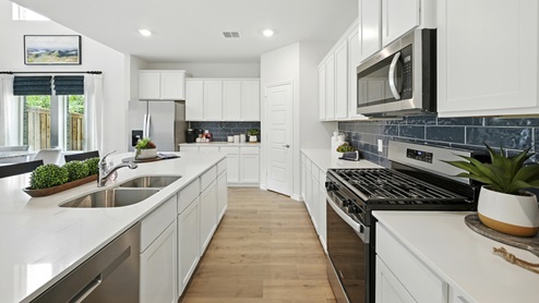 H235 Bastrop Floorplan Elevation F Kitchen Gallery Image-Lilybrooke at Legacy Hills in Celina, TX
