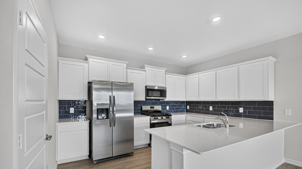 H218 Rosemary Floorplan Kitchen Gallery Image-Lilybrooke at Legacy Hills in Celina, TX