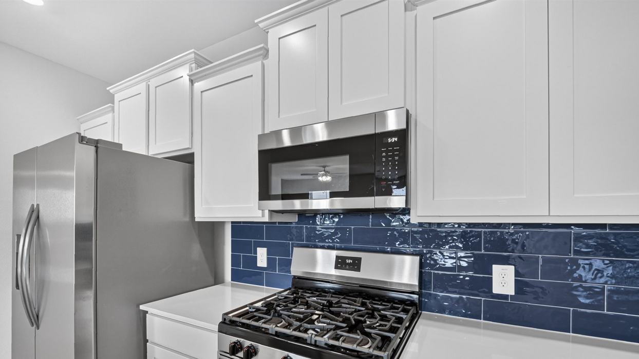 H218 Rosemary Floorplan Kitchen Gallery Image-Lilybrooke at Legacy Hills in Celina, TX