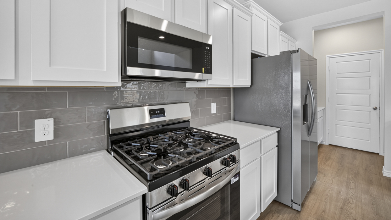 Poteet floorplan Elevation B Kitchen Gallery Image-Lilybrooke at Legacy Hills in Celina, Tx
