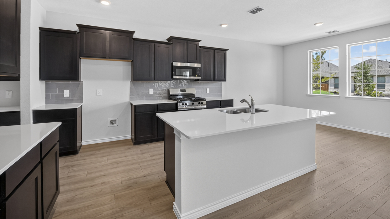 H222 Owens Floorplan Kitchen Gallery Image-Lilybrooke at Legacy Hill in Celina, TX