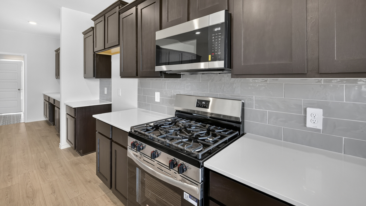 H222 Owens Floorplan Kitchen Gallery Image-Lilybrooke at Legacy Hill in Celina, TX