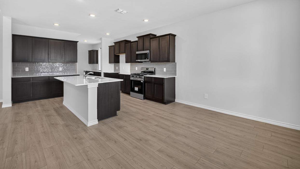 H222 Owens Floorplan Kitchen Gallery Image-Lilybrooke at Legacy Hill in Celina, TX
