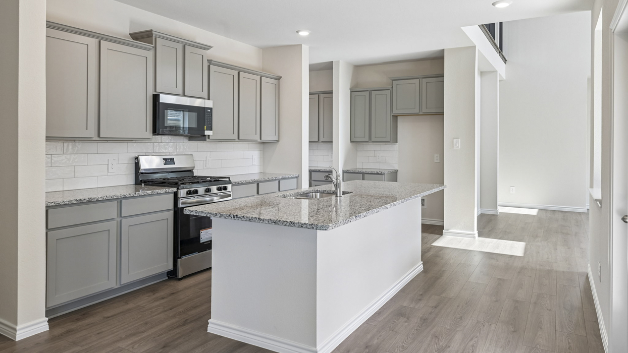 H223 Oscar Floorplan Kitchen Gallery Image-Lilybrooke at Legacy Hill in Celina, TX
