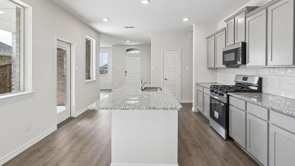 H223 Oscar Floorplan Kitchen Gallery Image-Lilybrooke at Legacy Hill in Celina, TX