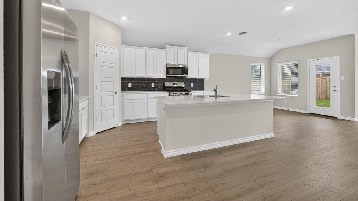 H106 Bentworth Floorplan Kitchen Gallery Image-Lilybrooke at Legacy Hills in Celina, TX