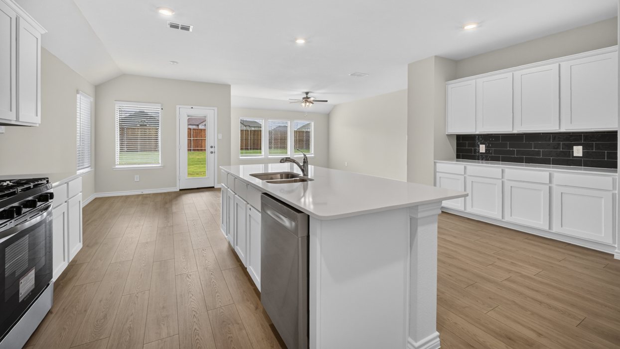 H106 Bentworth Floorplan Kitchen Gallery Image-Lilybrooke at Legacy Hills in Celina, TX