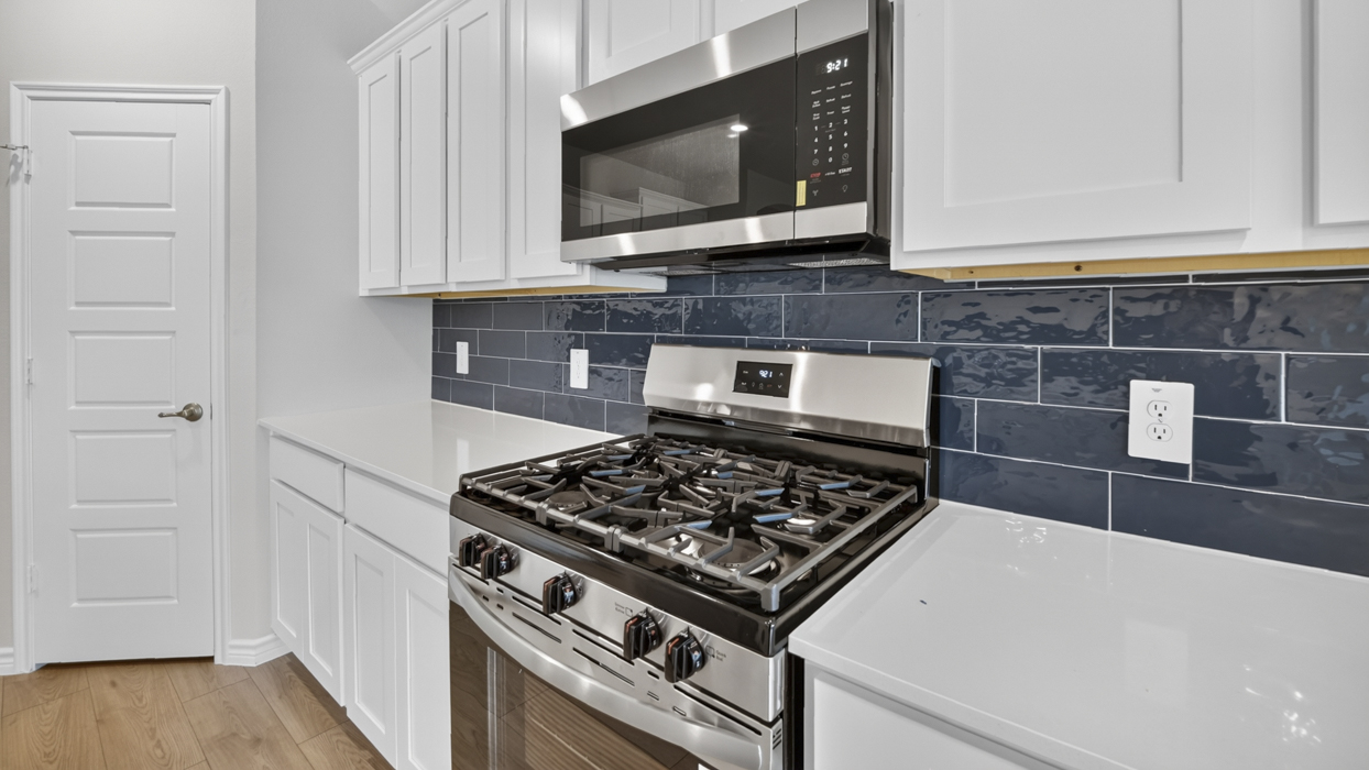 H106 Bentworth Floorplan Kitchen Gallery Image-Lilybrooke at Legacy Hills in Celina, TX