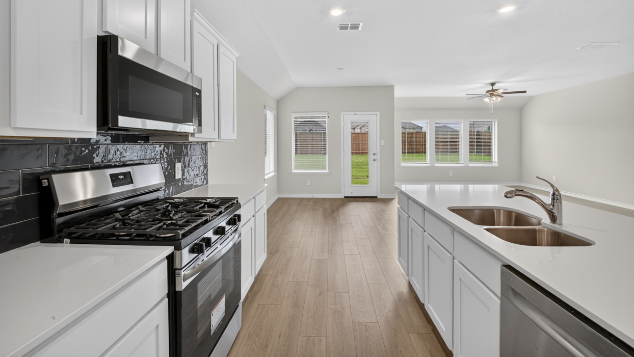 H106 Bentworth Floorplan Kitchen Gallery Image-Lilybrooke at Legacy Hills in Celina, TX