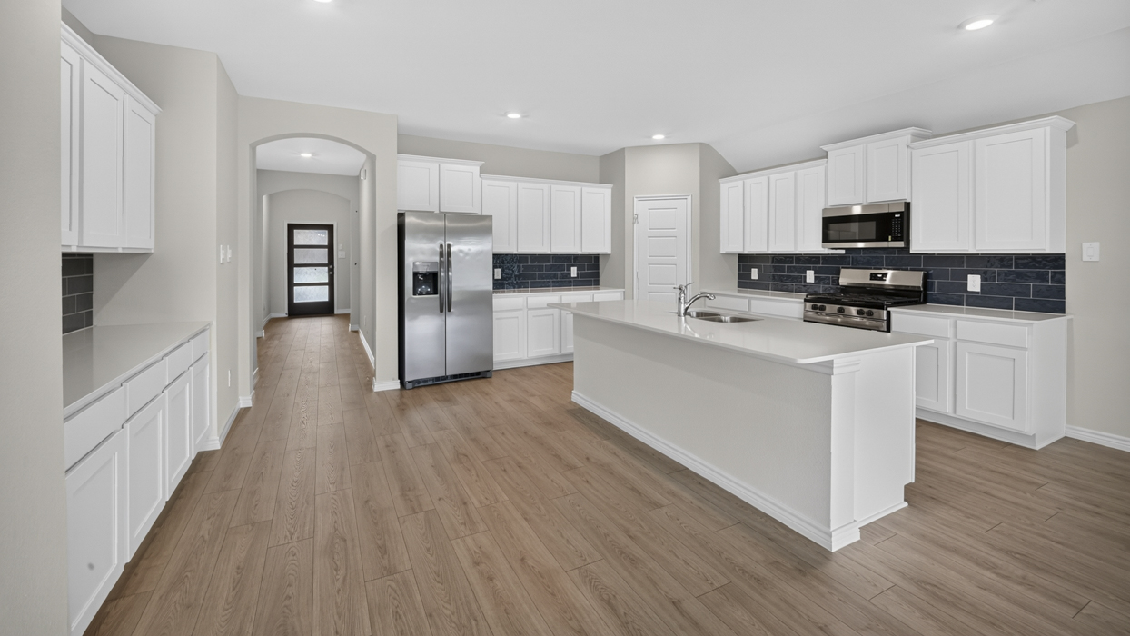 H106 Bentworth Floorplan Kitchen Gallery Image-Lilybrooke at Legacy Hills in Celina, TX