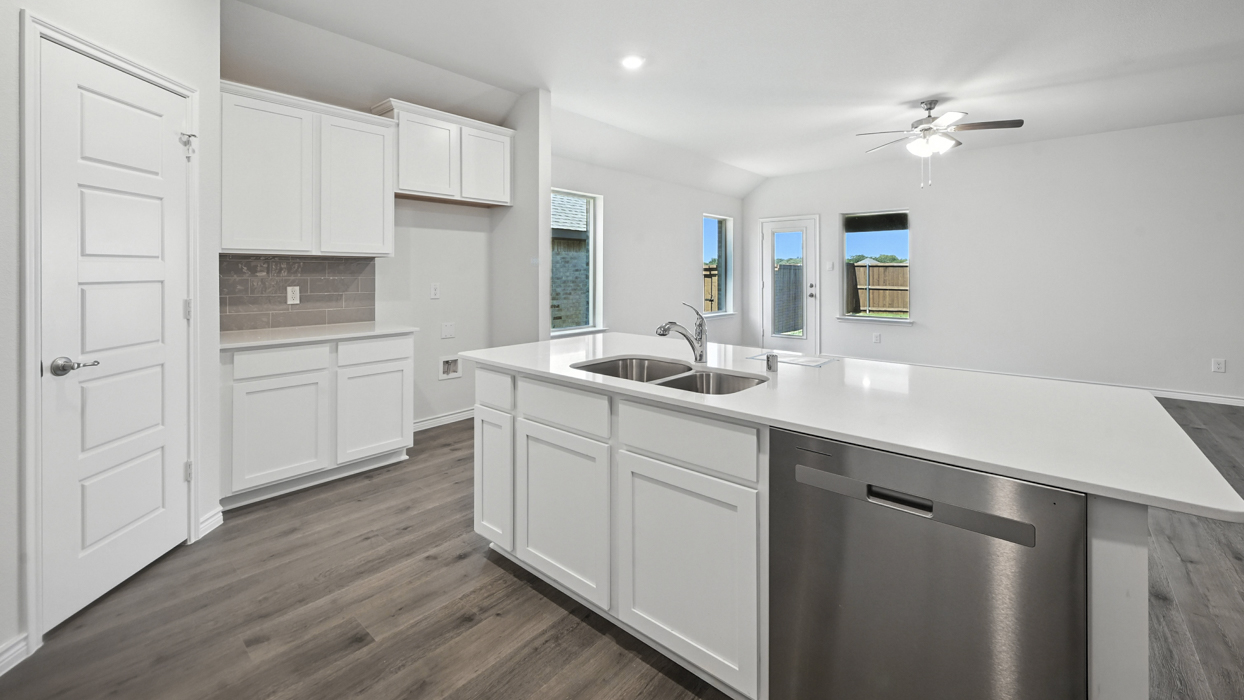 H133 Violet Floorplan kitchen gallery image at Lilybrooke at Legacy Hills in Celina TX