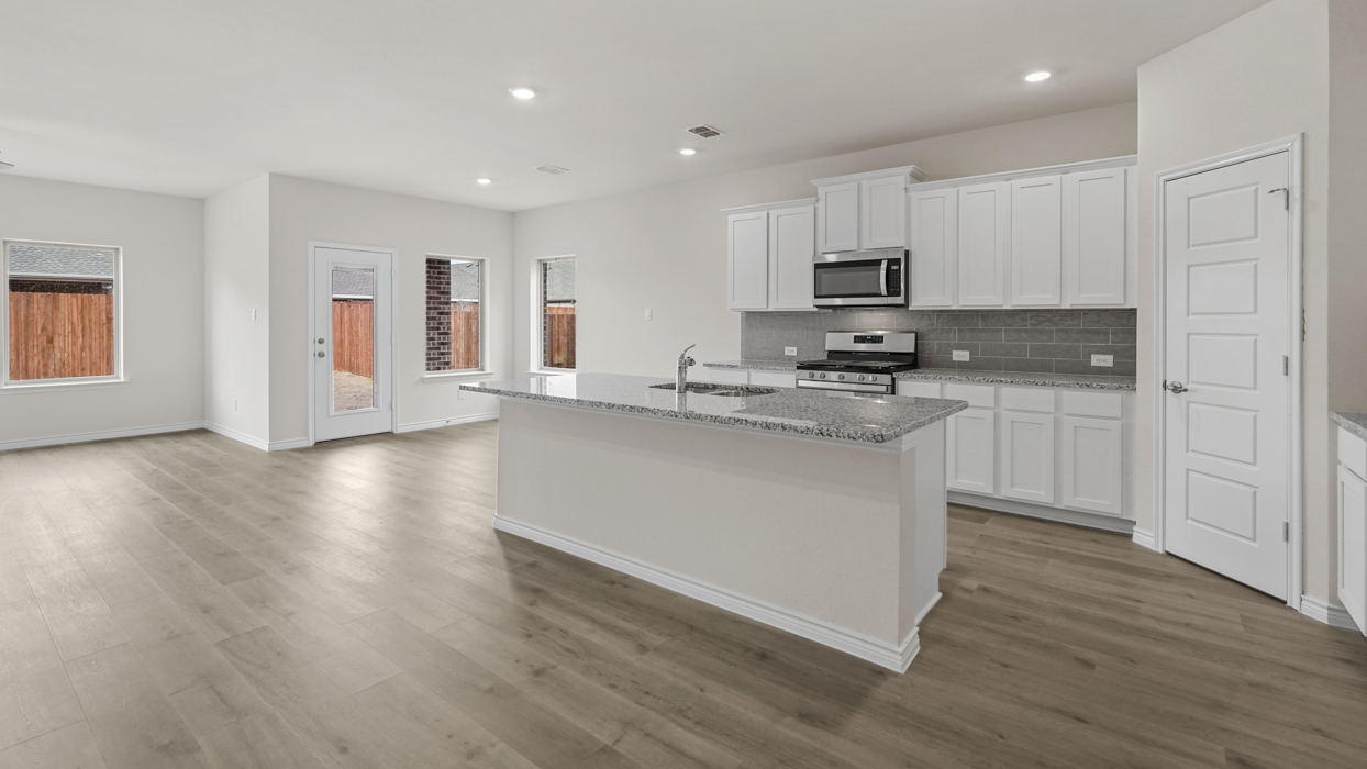 H229 Ivery II Floorplan Elevation B Kitchen Gallery Image-Lillybrooke at Legacy Hills in Celina, TX