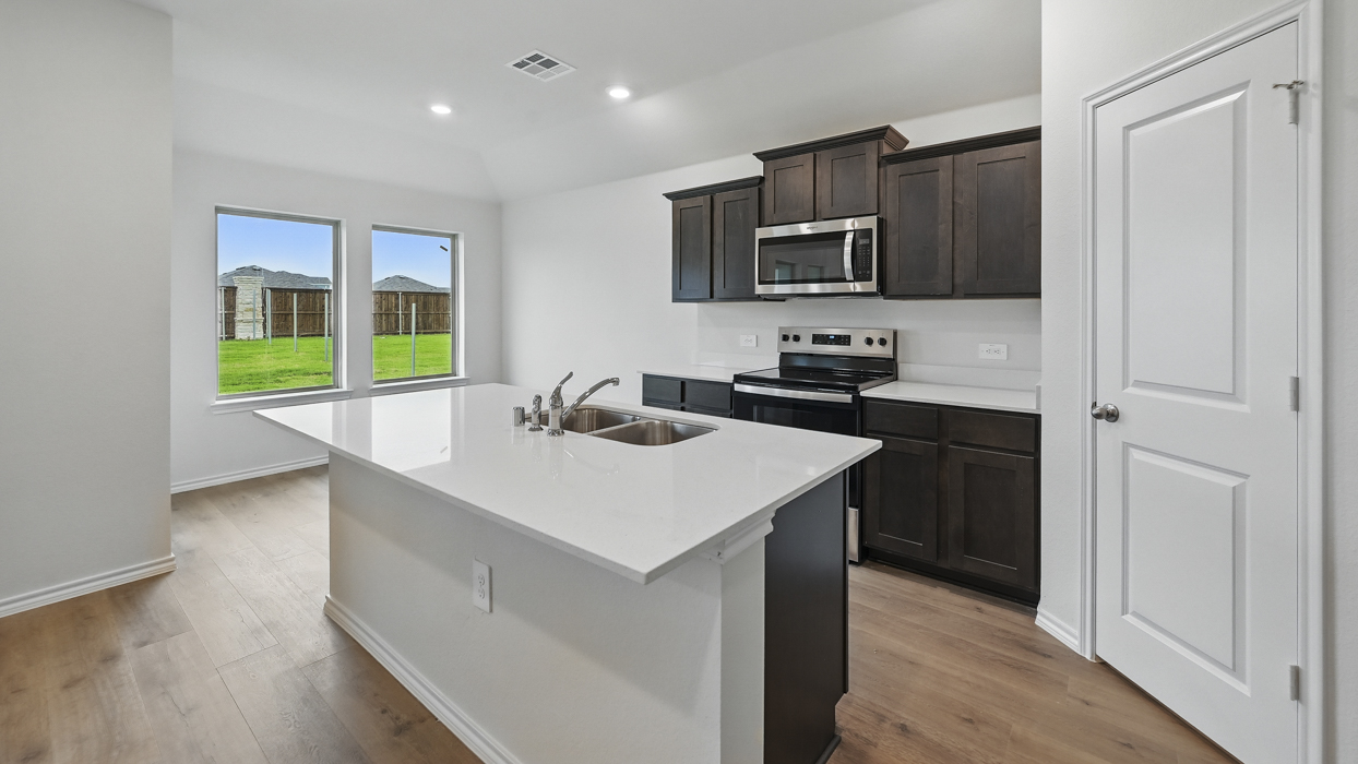 Ashburn Floorplan Elevation B Kitchen Gallery Image - Three Oaks in Sherman, TX