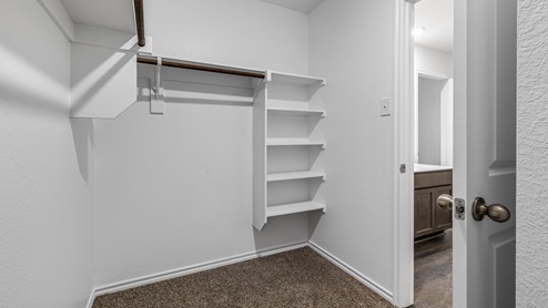 X40B Bellvue floorplan bedroom 1 walk-in closet gallery image - Three Oaks in Sherman TX