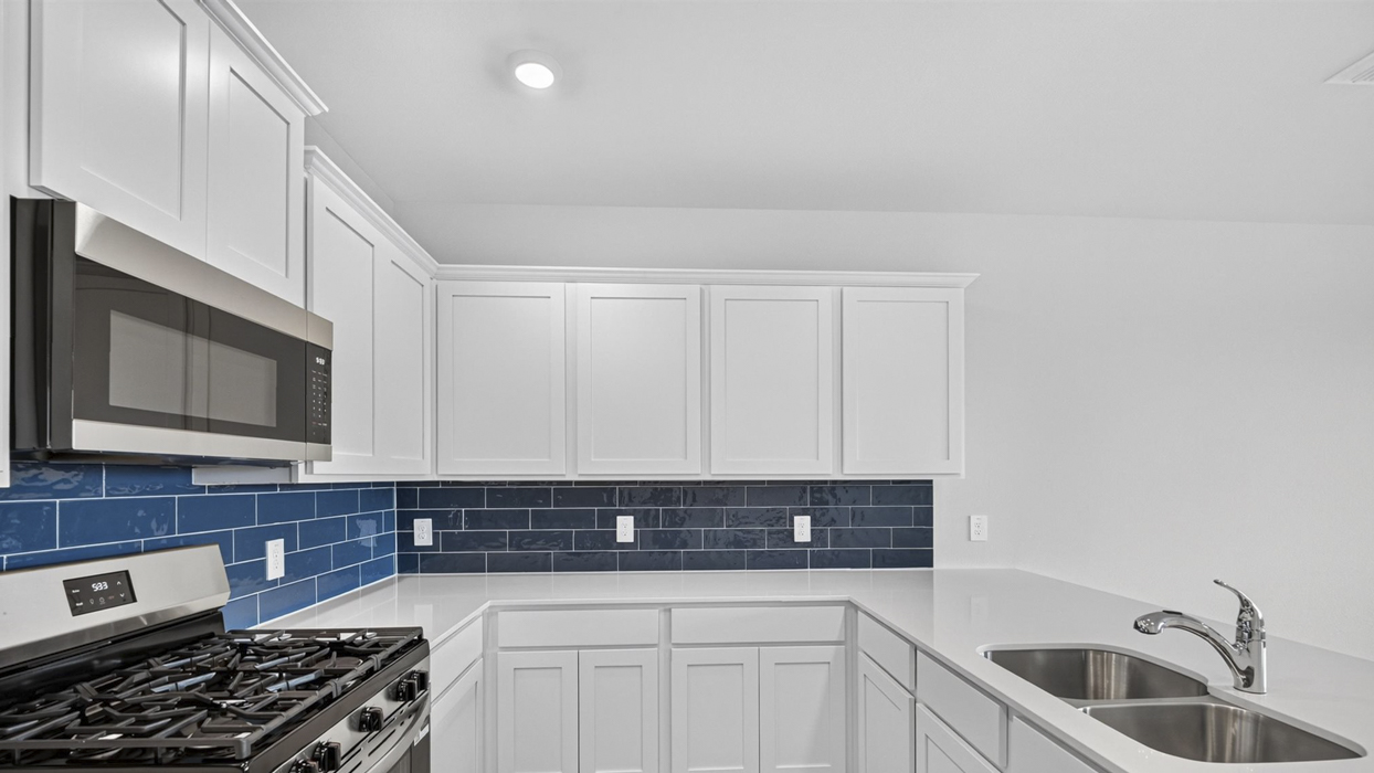 H218 Rosemary Floorplan Kitchen Gallery Image-Magnolia at Legacy Hills in Celina, TX