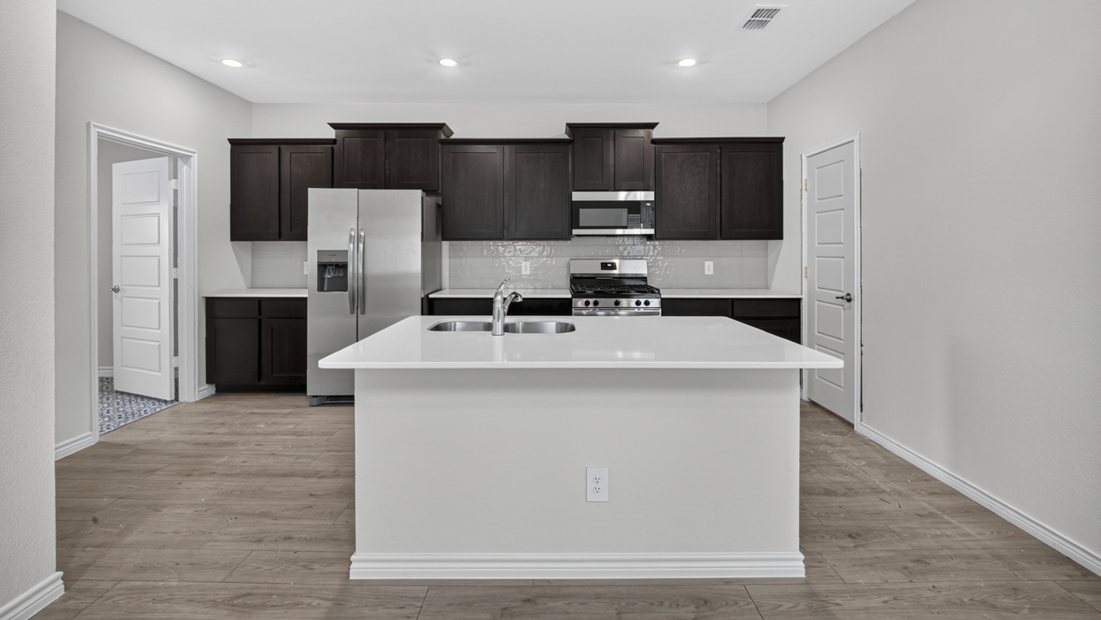 H220 Selma Floorplan Kitchen Gallery Image-Magnolia at Legacy Hills in Celina, TX