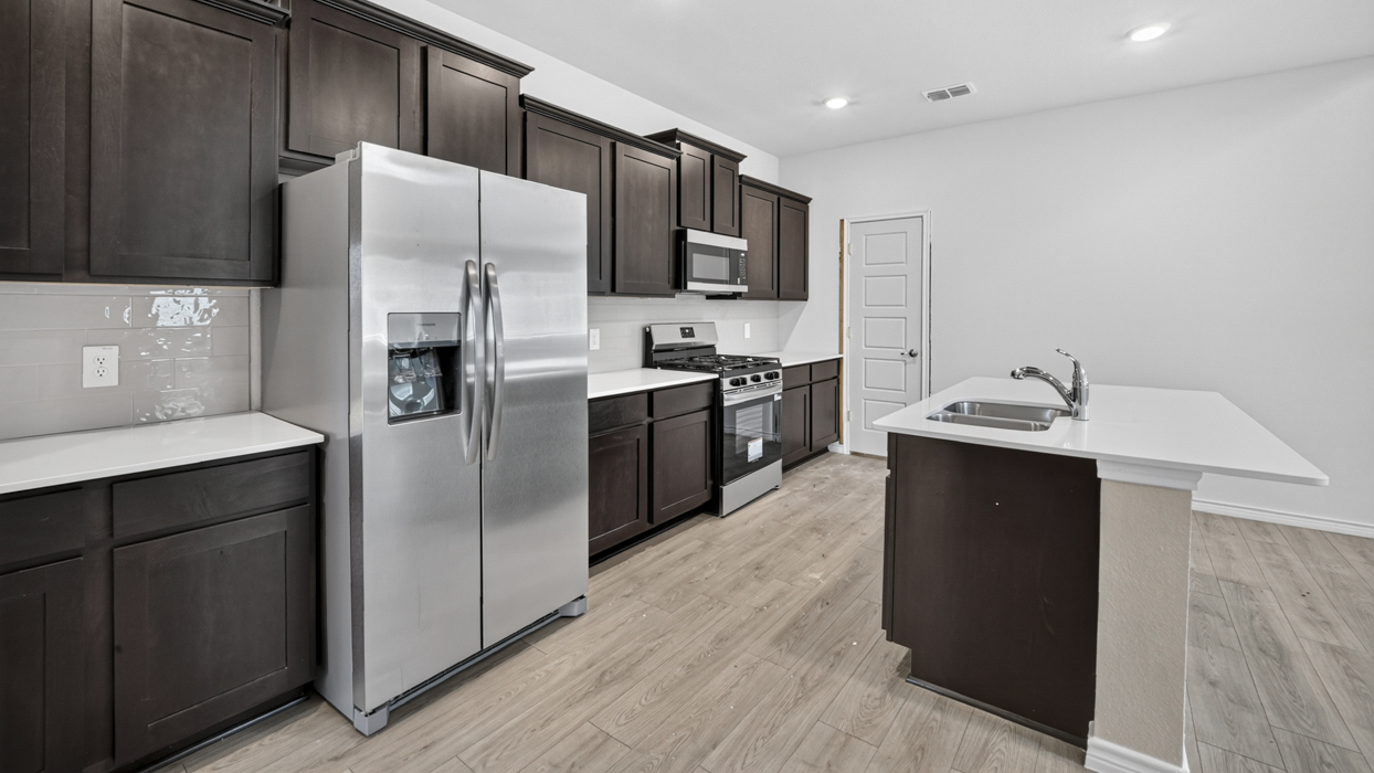 H220 Selma Floorplan Kitchen Gallery Image-Magnolia at Legacy Hills in Celina, TX