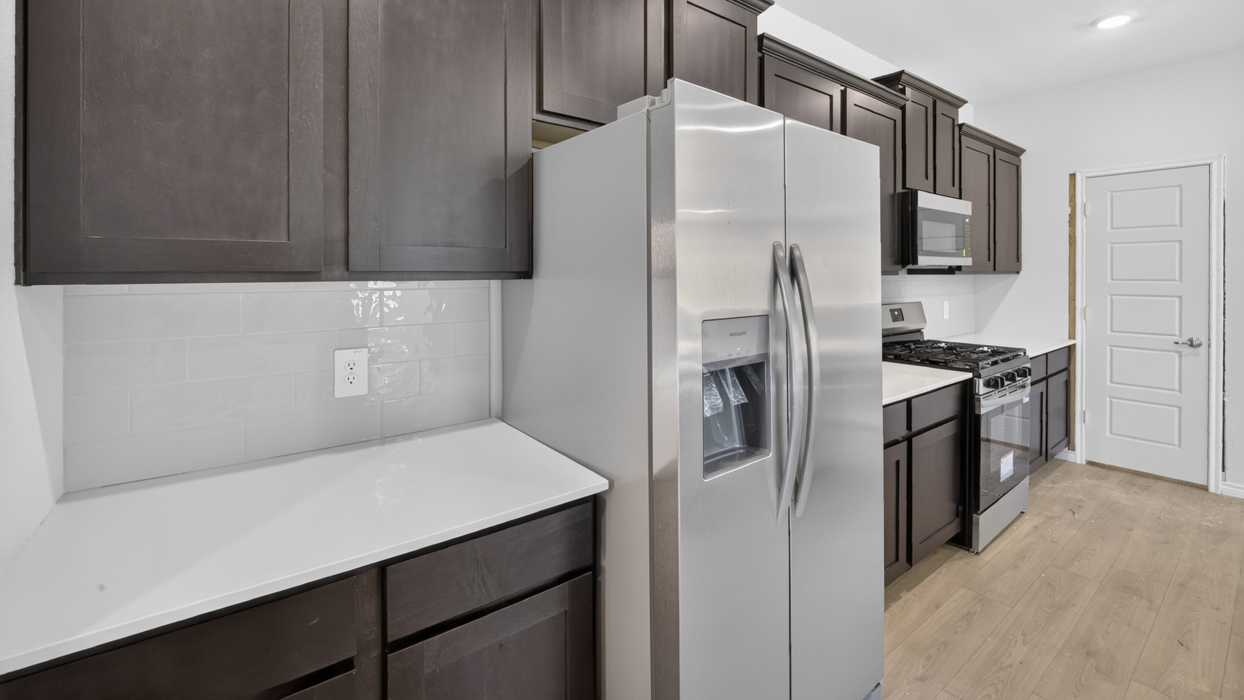 H220 Selma Floorplan Kitchen Gallery Image-Magnolia at Legacy Hills in Celina, TX