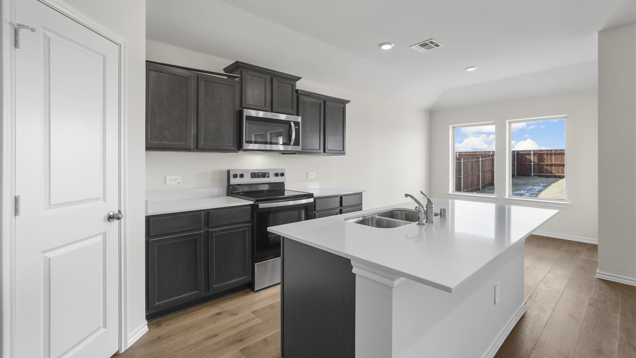 Bellvue Floorplan Kitchen Gallery Image-Cottonwood in Dorchester, Tx