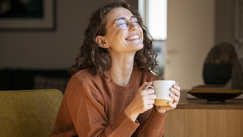 woman with mug enjoying the day