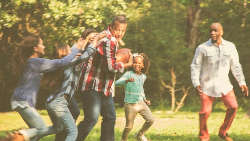 family playing football