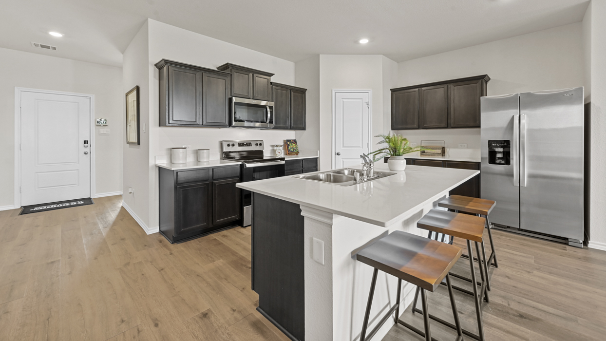 Ozark Floorplan Elevation B Kitchen Gallery Image - Frontier Pointe in Princeton, TX