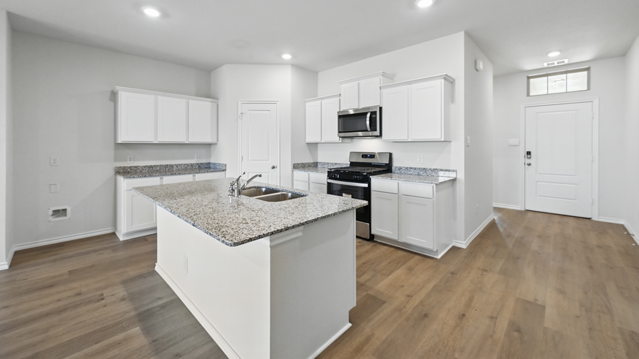 Ozark Floorplan Elevation B Kitchen Gallery Image - Frontier Pointe in Princeton, TX
