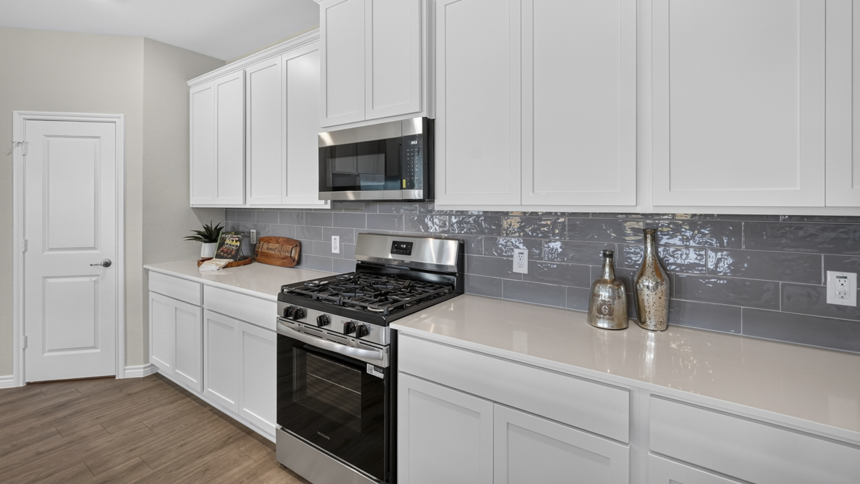 Bastrop Floorplan Elevation E/F Kitchen Gallery Image - Windchime in Celina, TX