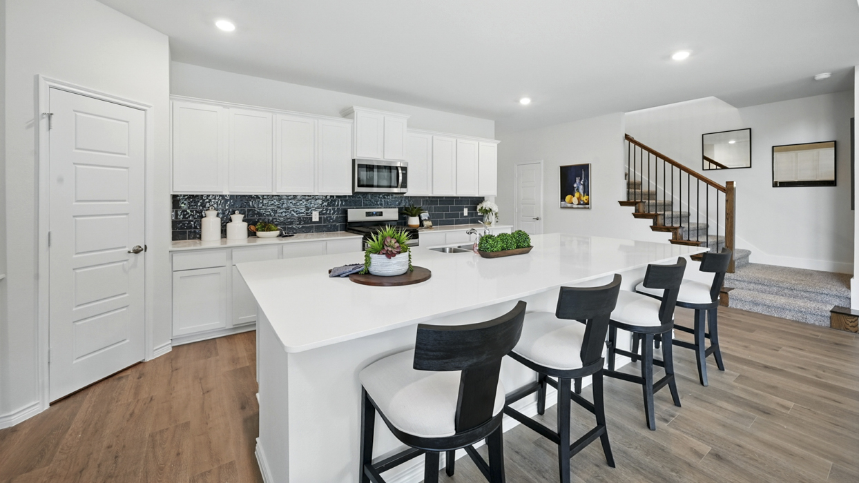 Bastrop Floorplan Elevation E/F Kitchen Gallery Image - Windchime in Celina, TX