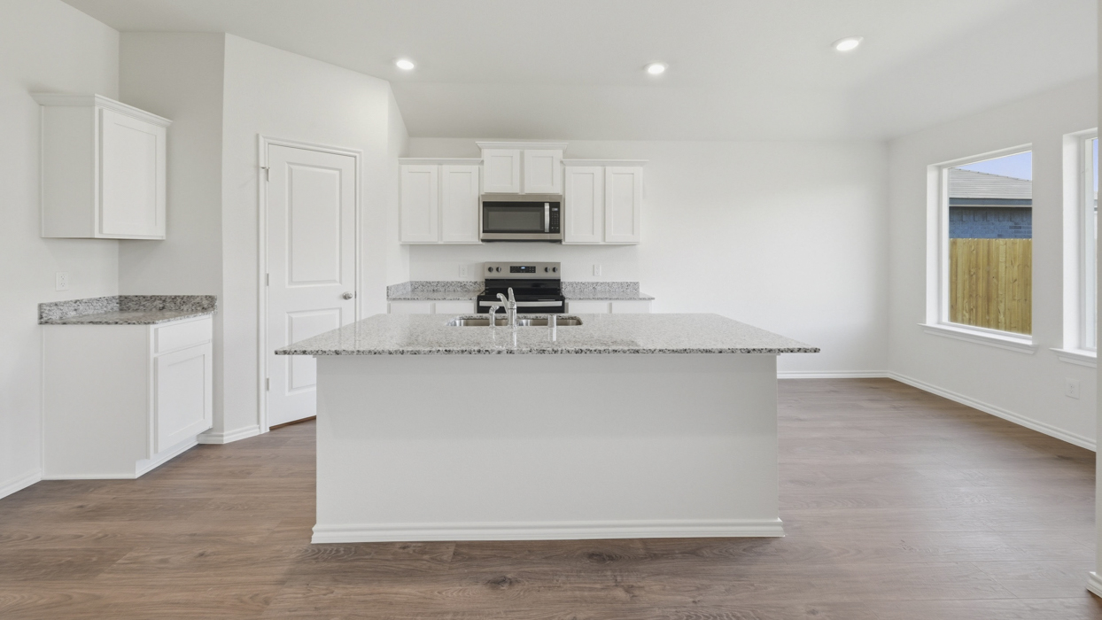 Ashburn Floorplan Elevation B Kitchen Gallery Image - Forestbrook Estates in Paris, TX
