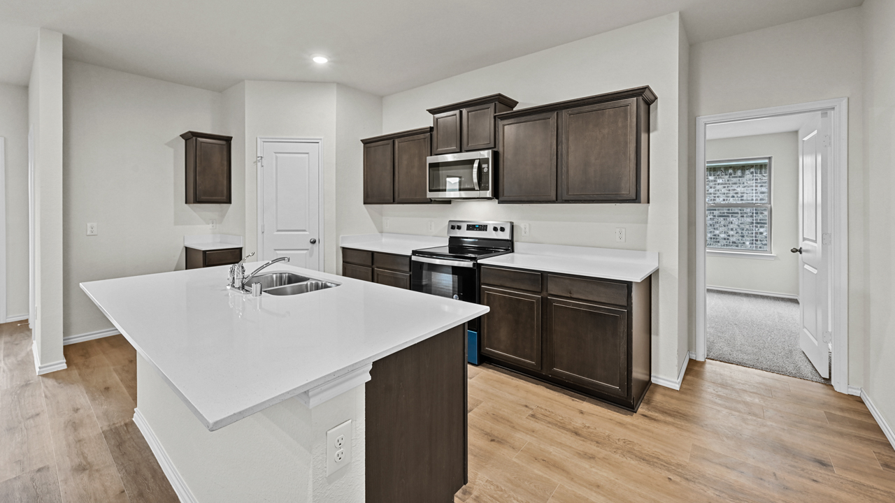 Camden Floorplan Elevation B Kitchen Gallery Image - Forestbrook Estates in Paris, TX