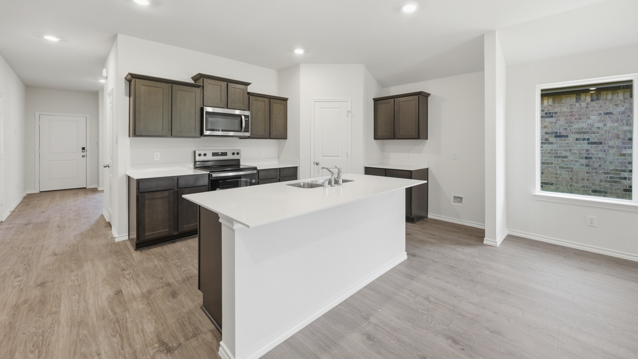 Lakeway Floorplan Elevation B Kitchen Gallery Image - Forestbrook Estates in Paris, TX