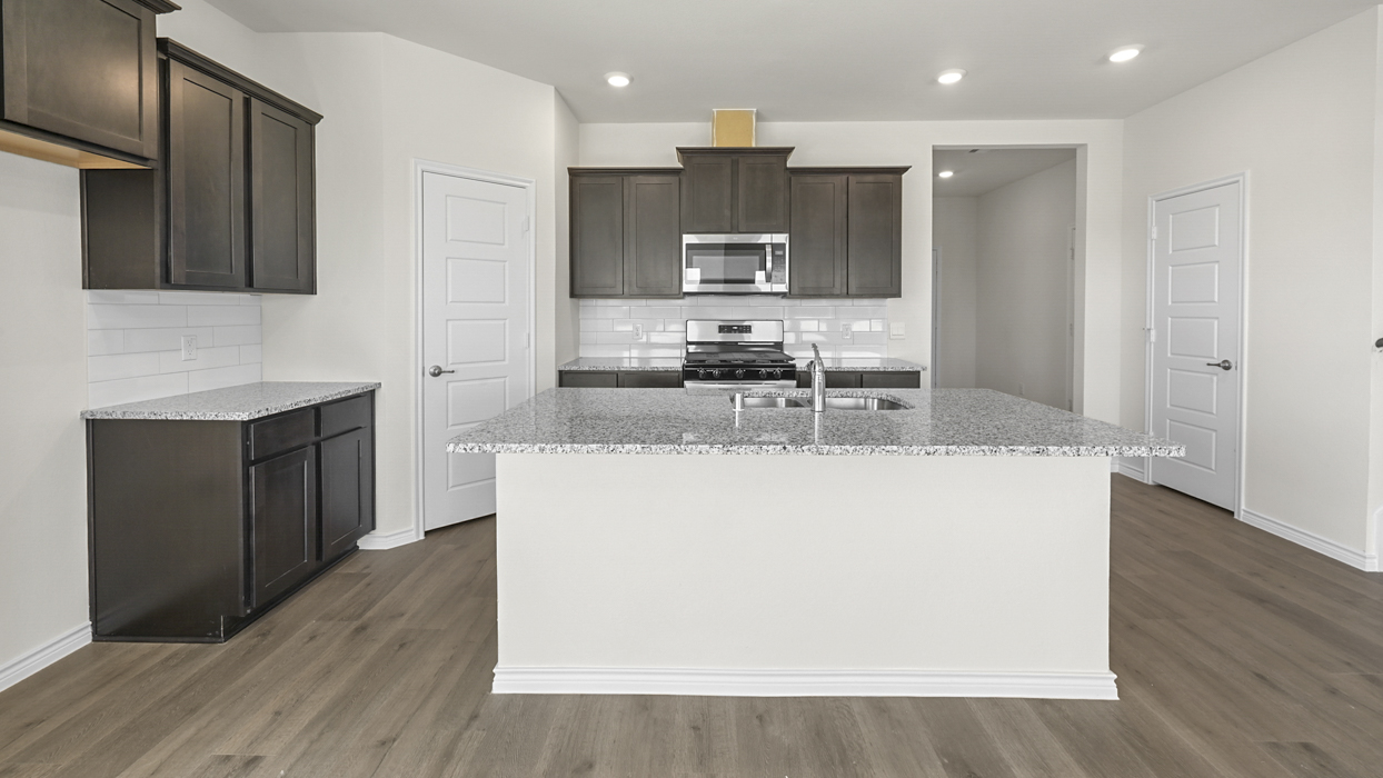 H143 Cedarwood Floorplan Kitchen Gallery Image-Bel Air Village in Sherman, Tx