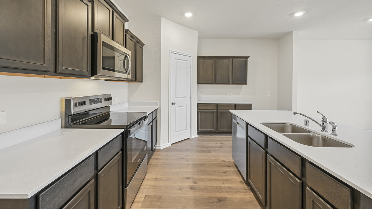 Ozark Floorplan Kitchen Gallery Image-Bel Air Village in Sherman, Tx