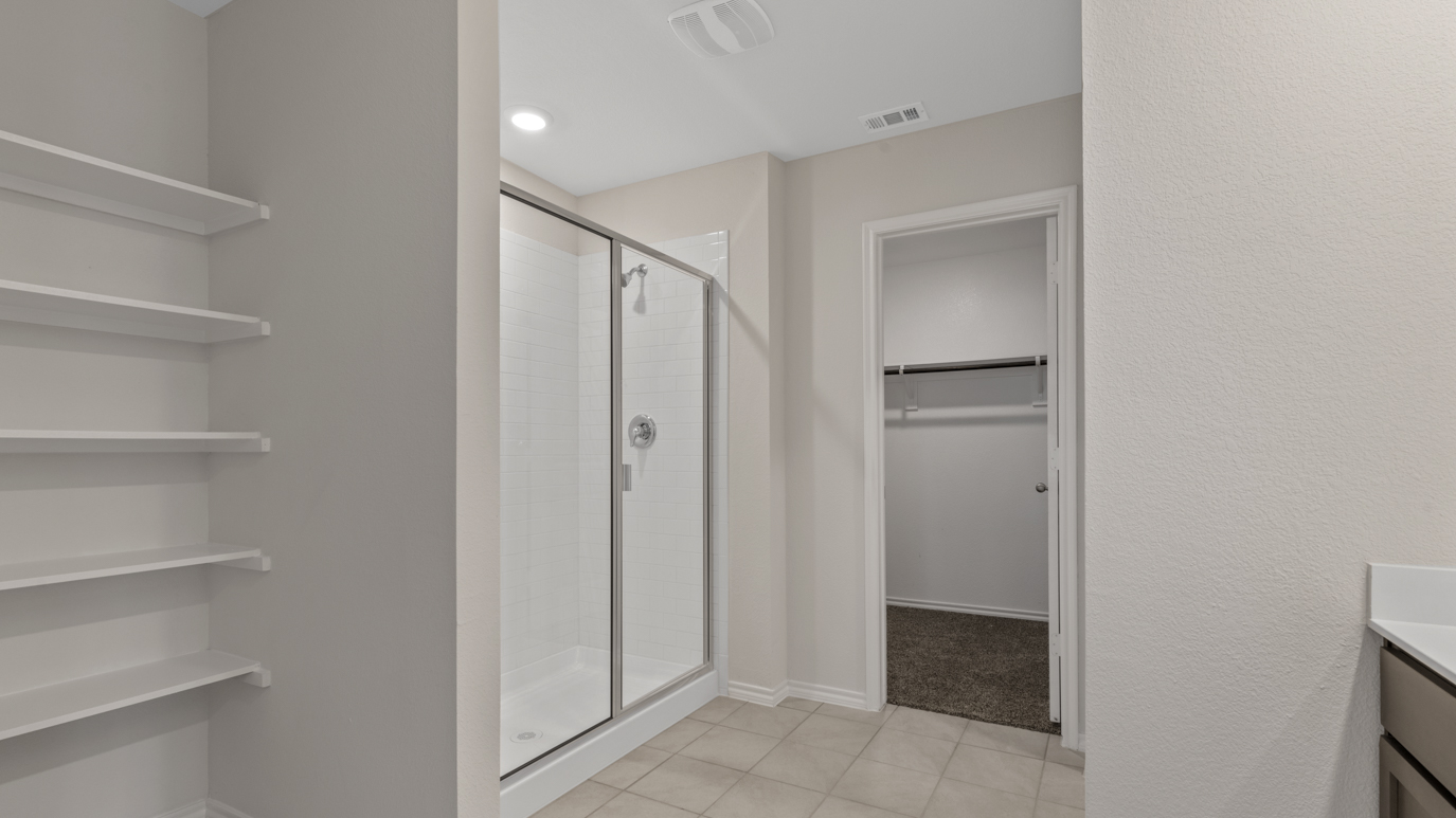 X40H Huntsville floorplan primary bedroom ensuite rendering at Stonewyck Farms in Ennis TX