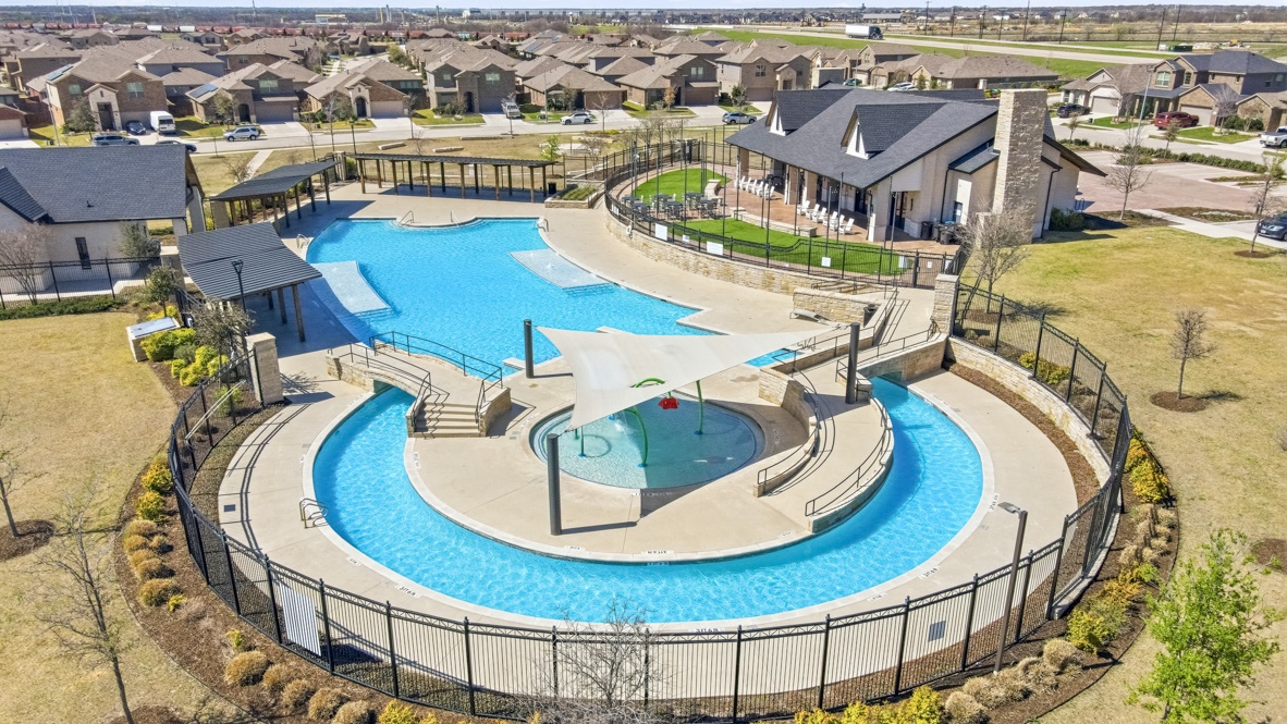 Aerial overview of resort-style community pool with children's play items
