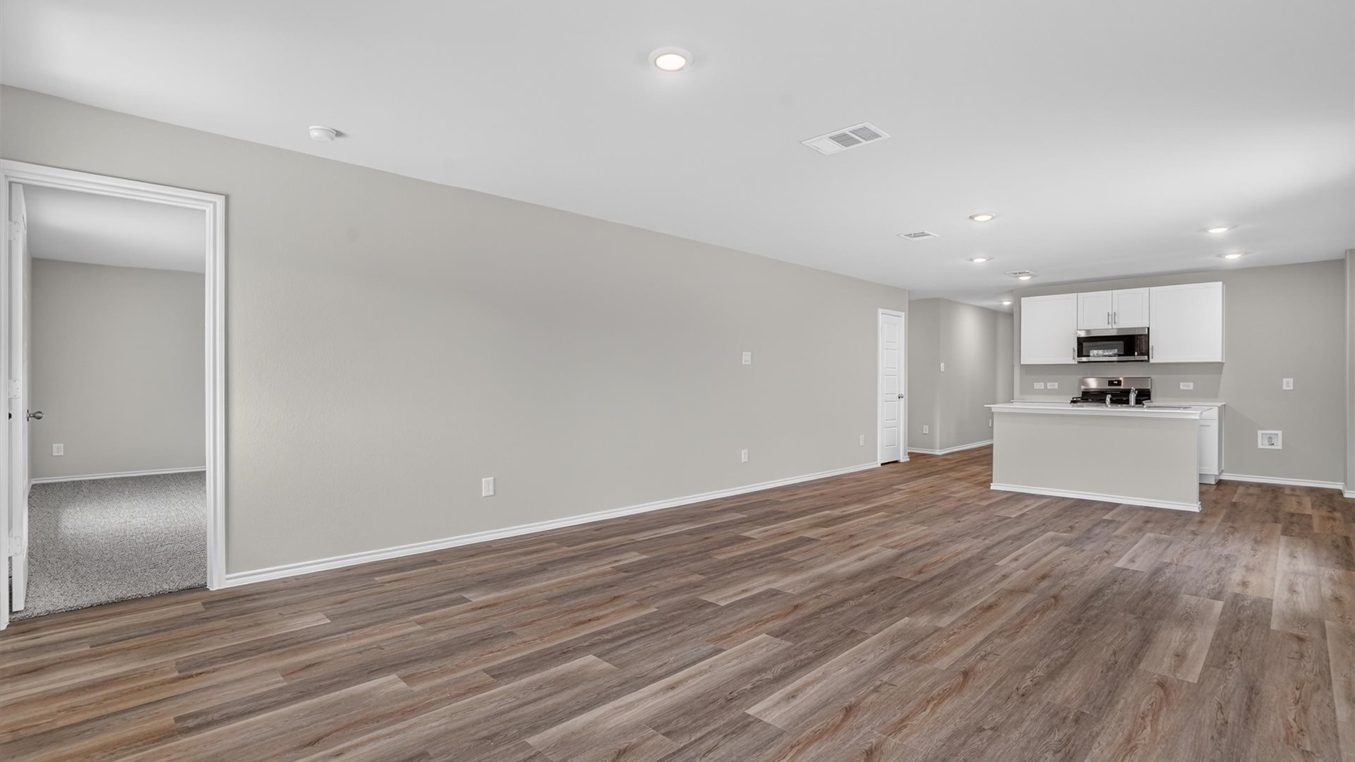 Open concept kitchen, dining, and living area