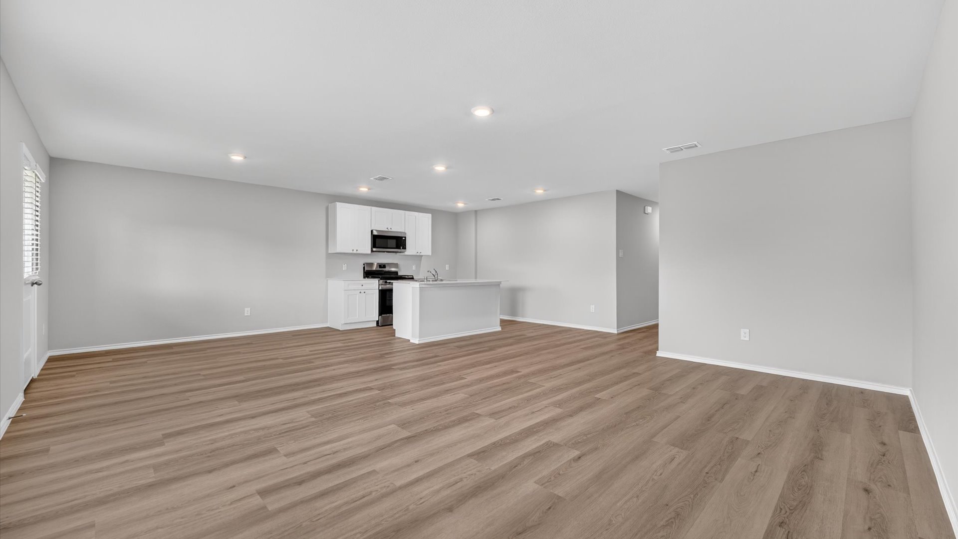 Open concept kitchen, dining, and living