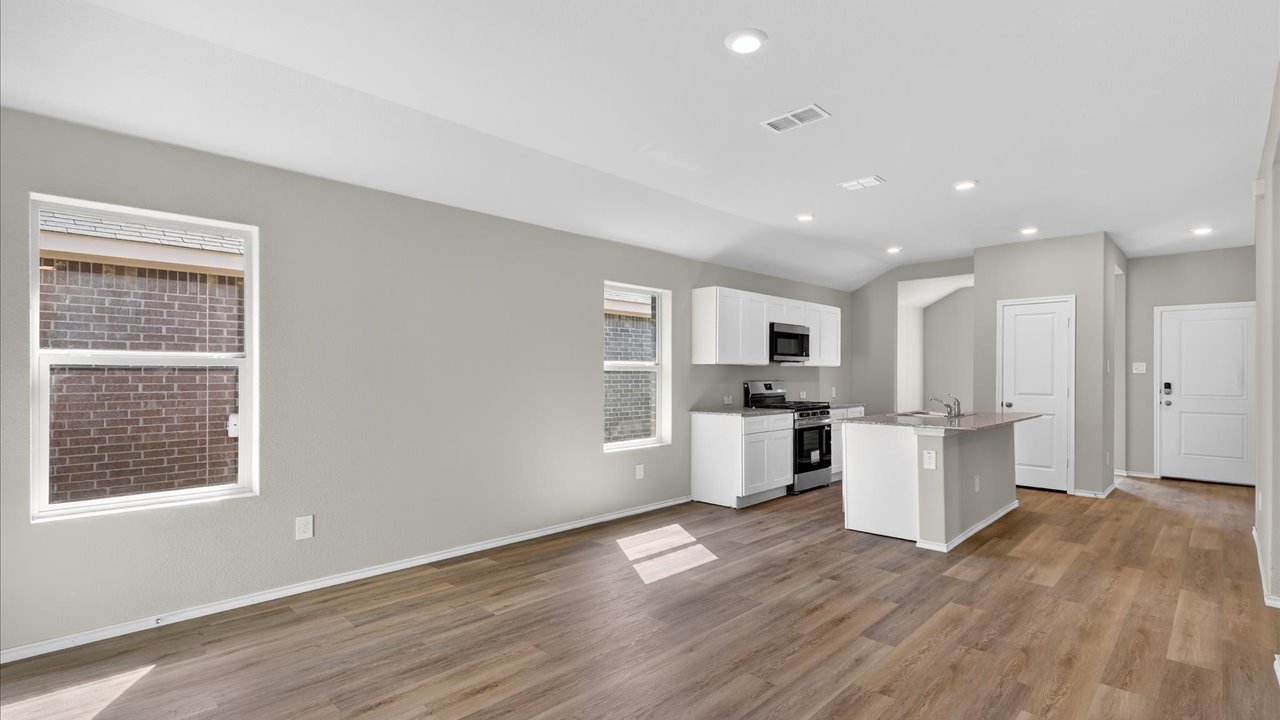 Open living, kitchen, and dining space