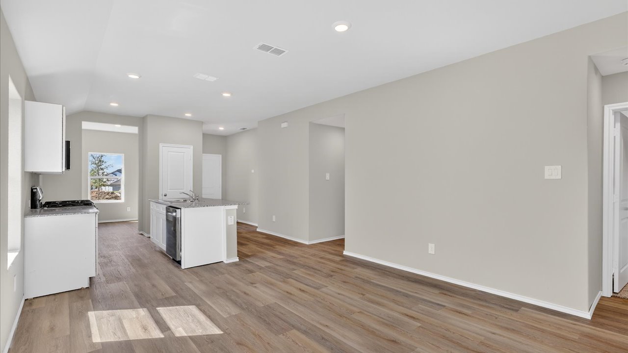 Open concept living, dining, and kitchen area