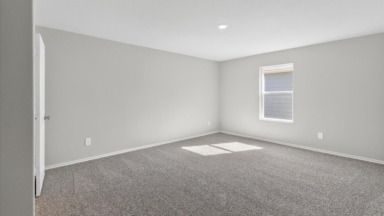 Bedroom 1 with plush carpet floors