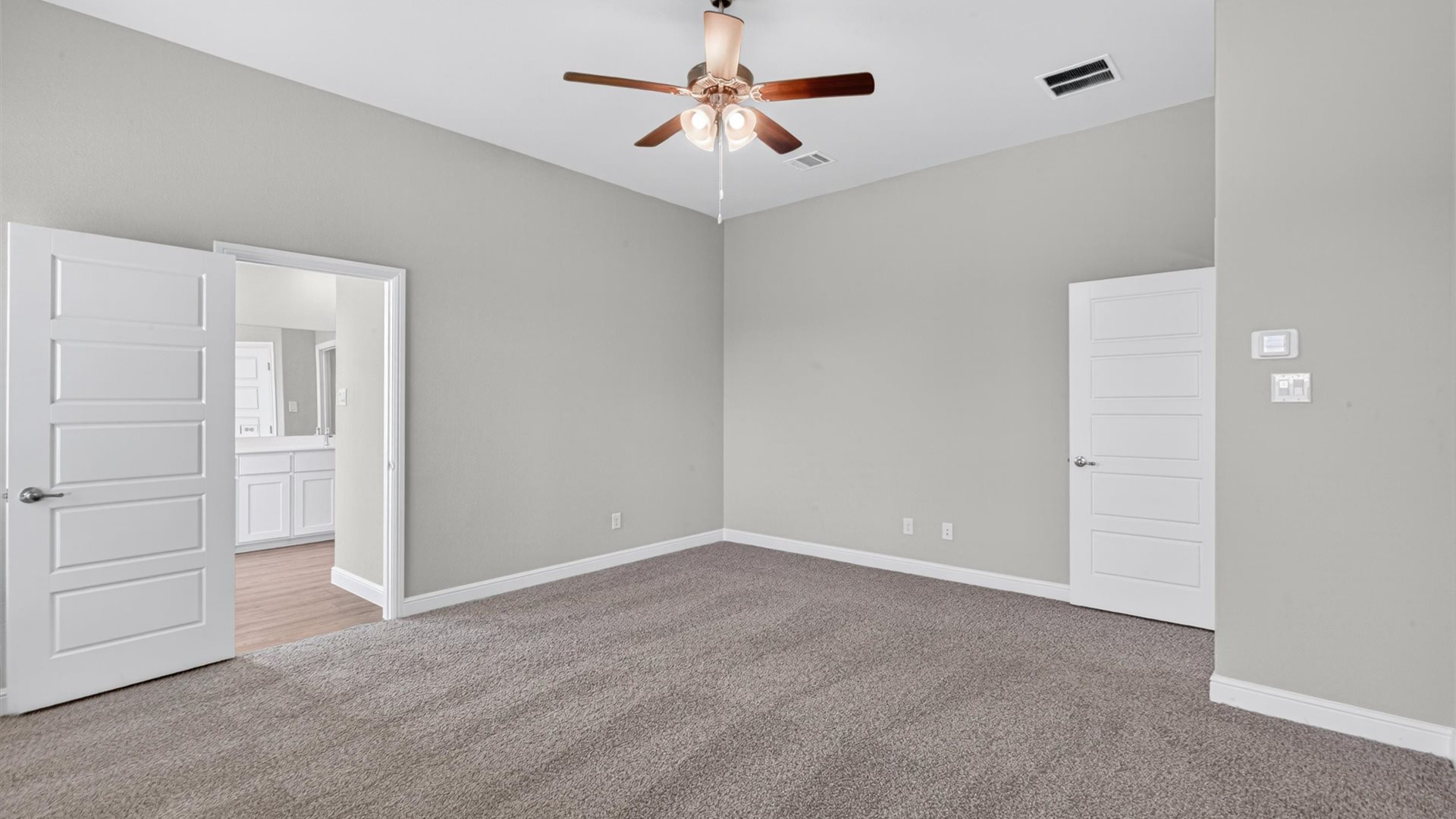 Primary bedroom with ensuite bathroom
